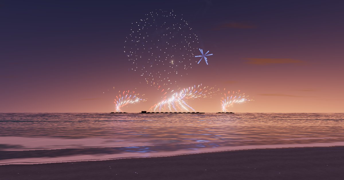 Firework bursts above three sprays of ground fireworks over a beach at dusk, the look of a SkyGreeting congratulations show